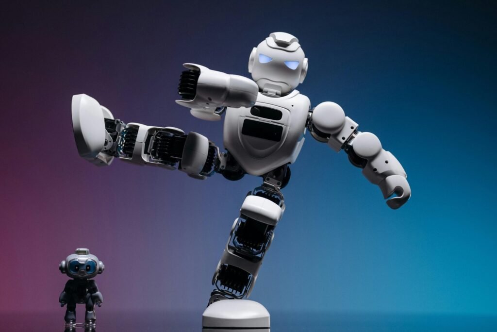A White Robot with Foot Above a Small Robot