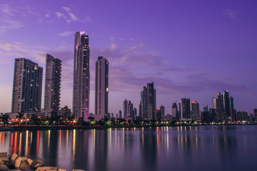 city with high rise buildings and view at night time