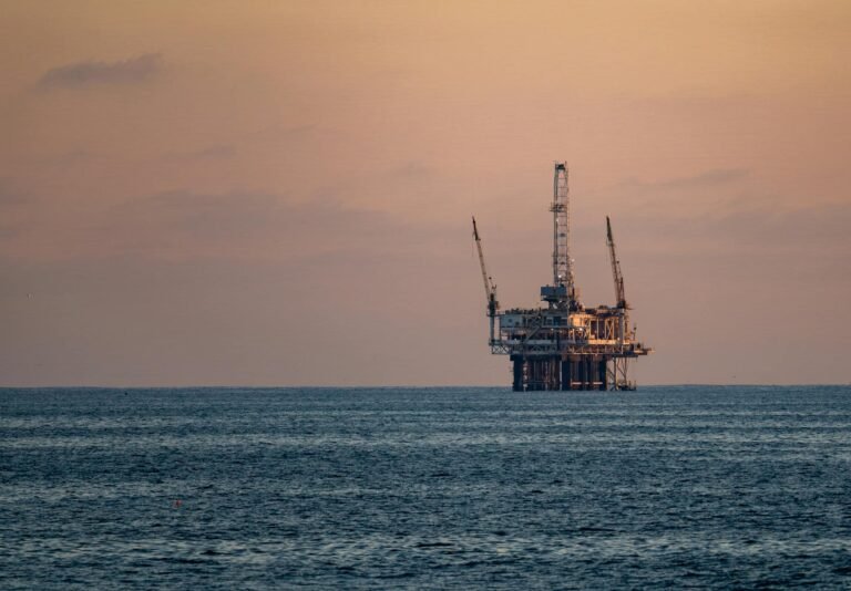 offshore oil rig at sunset in pacific ocean