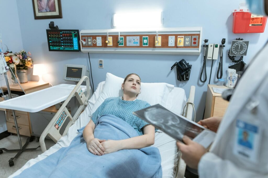 woman lying on hospital bed