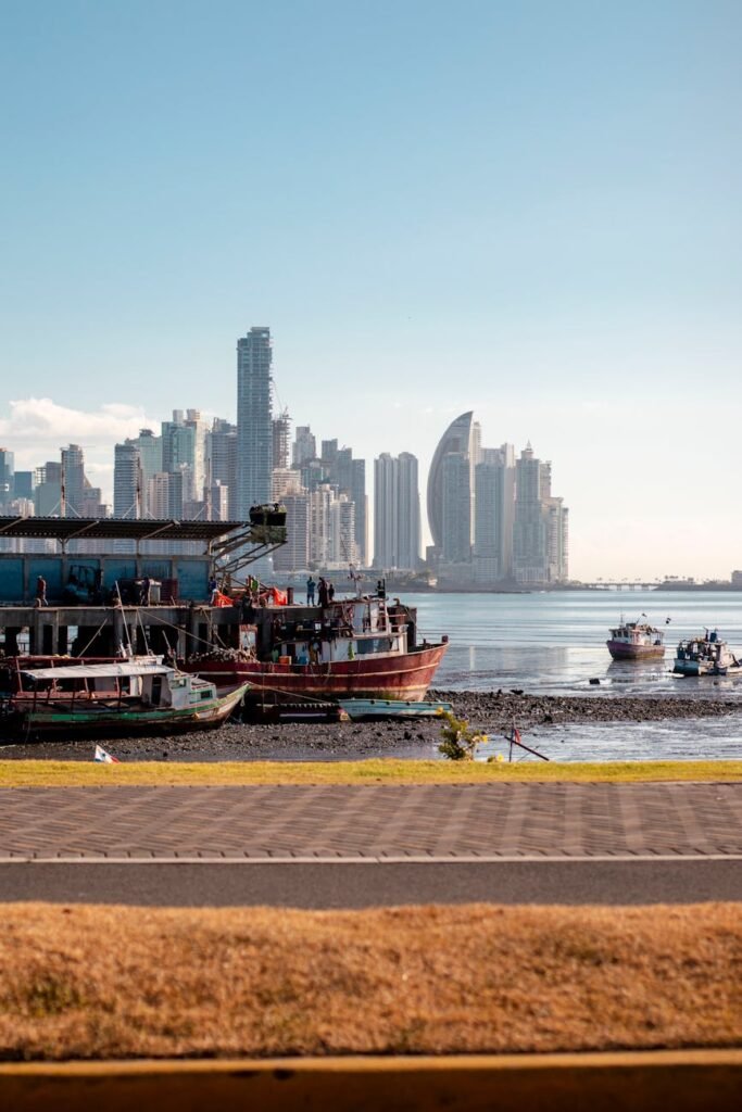 promenade on sea shore and city skyscrapers behind