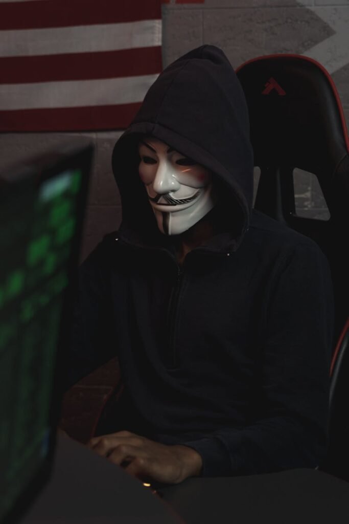 person in black hoodie sitting on chair