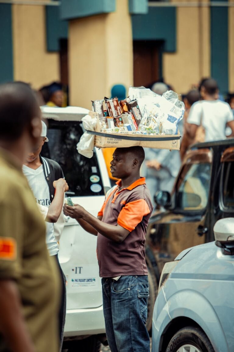 street vendor selling snacks in busy african city