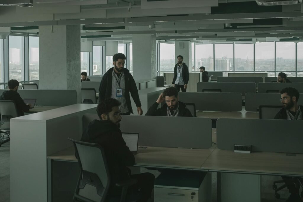 men looking alike inside an office