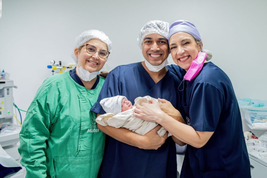 healthcare professionals celebrating newborn arrival