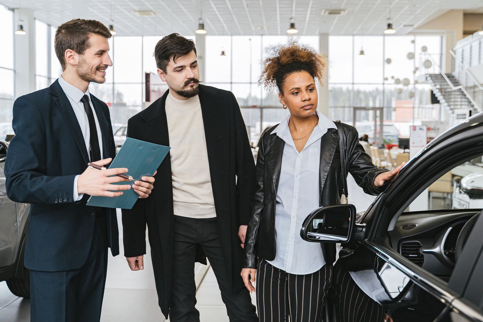 a couple at a car dealership