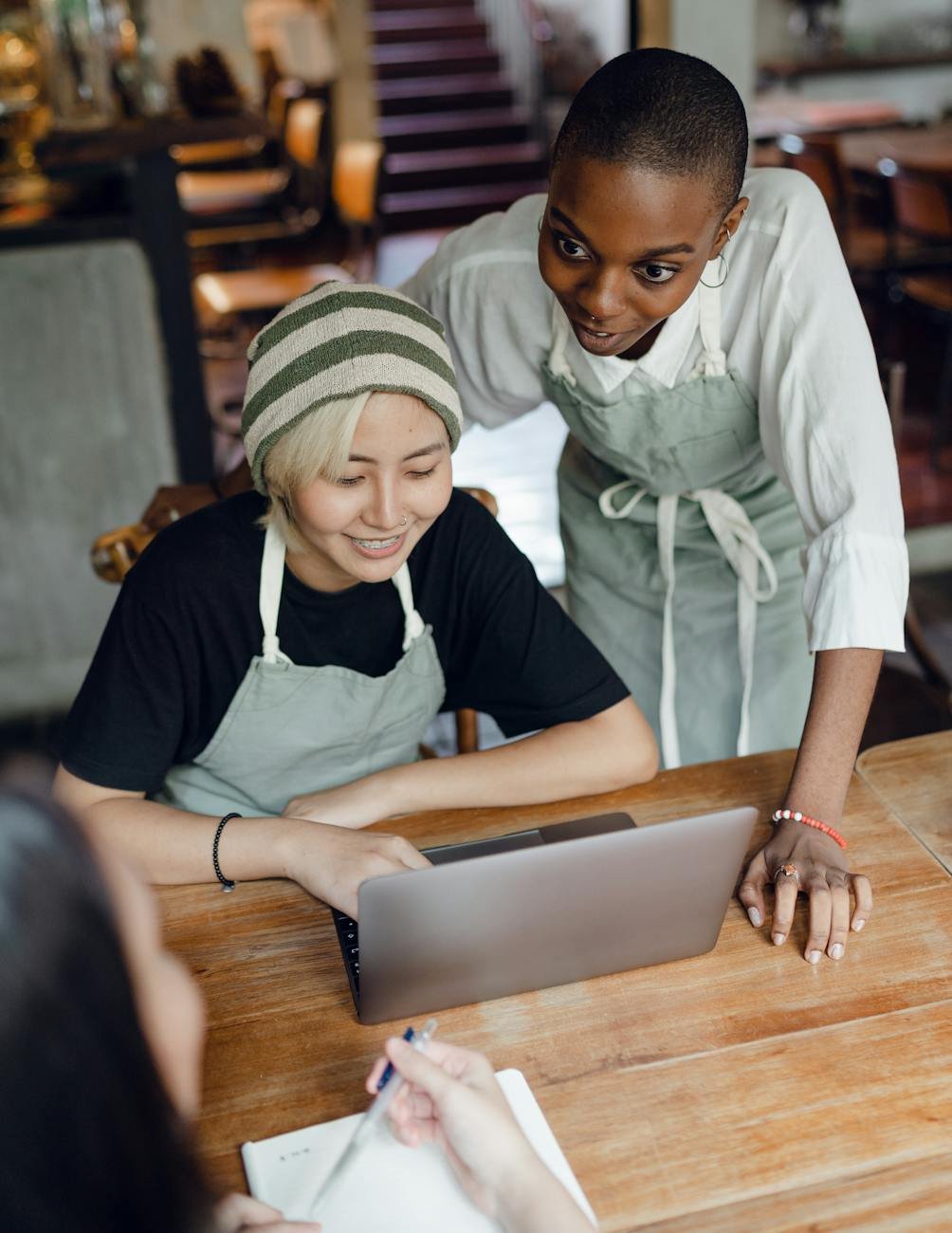 positive multiethnic female colleagues discussing business ideas