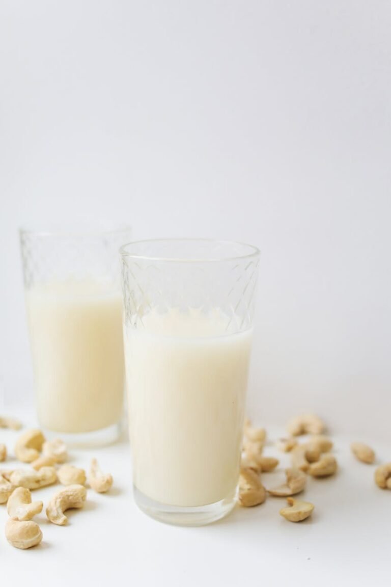 a milk in clear drinking glass