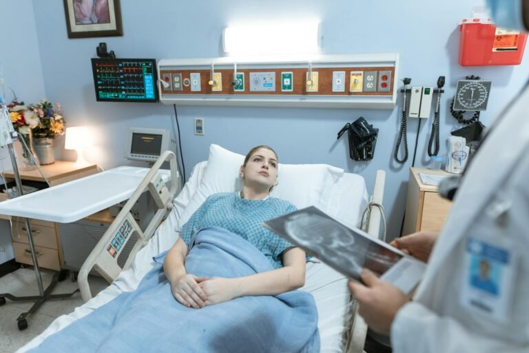woman lying on hospital bed