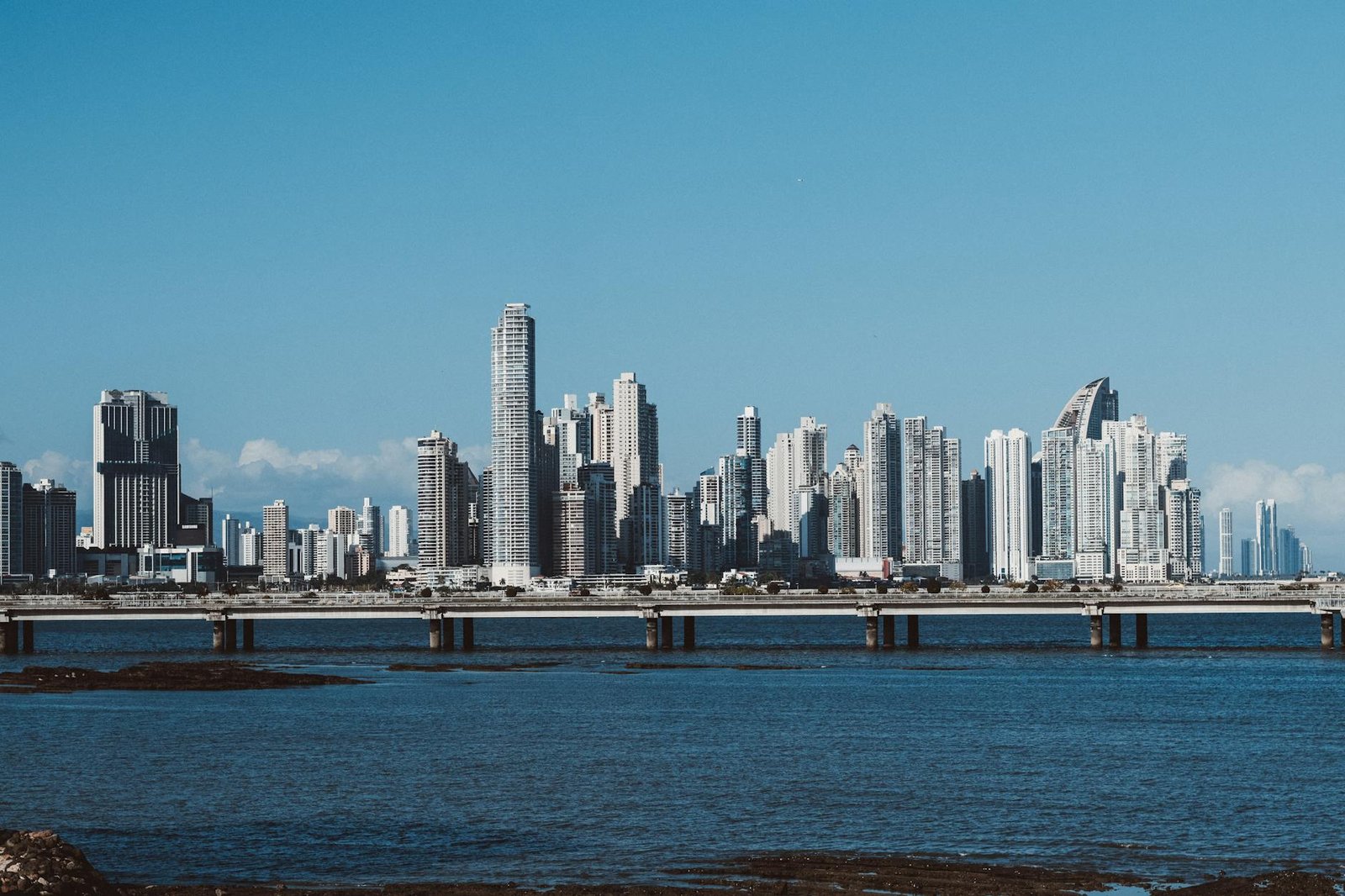 city buildings under the blue sky
