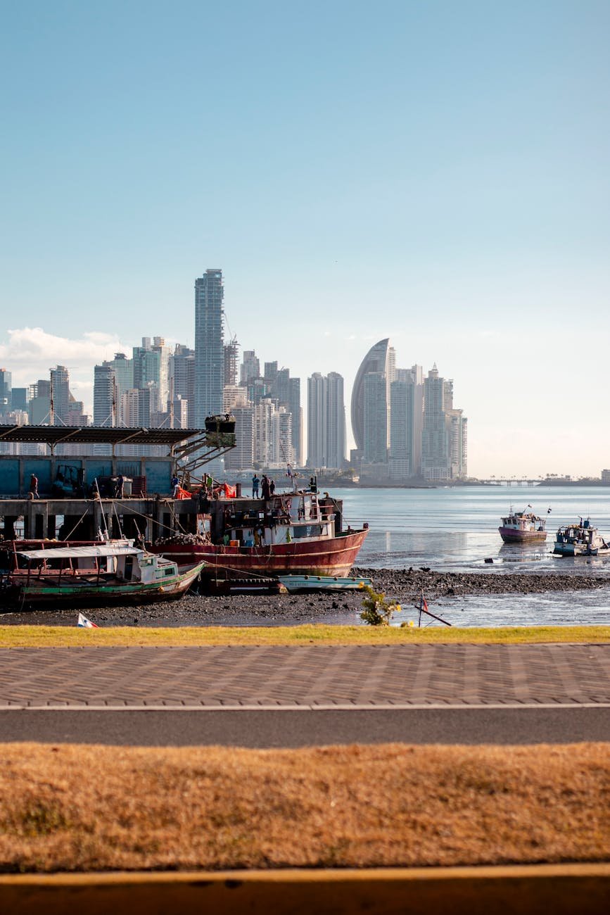 promenade on sea shore and city skyscrapers behind