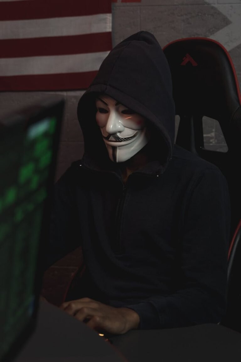 person in black hoodie sitting on chair
