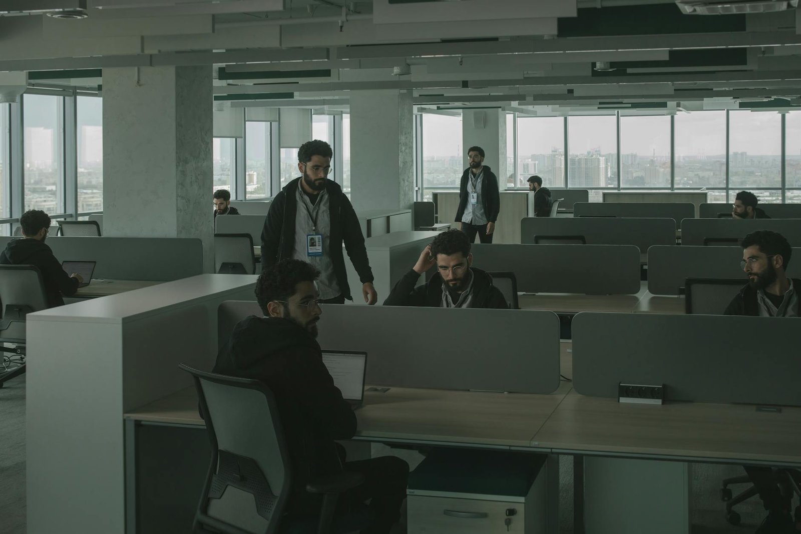 men looking alike inside an office