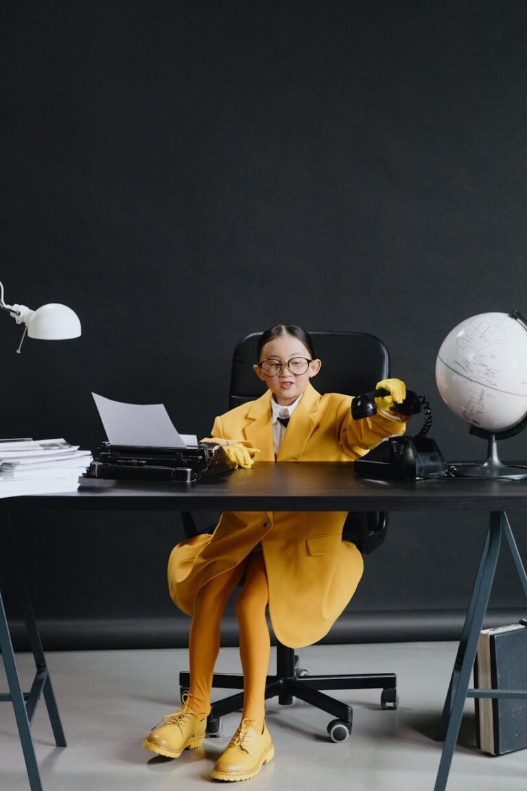 asian girl in yellow suit sitting by deck